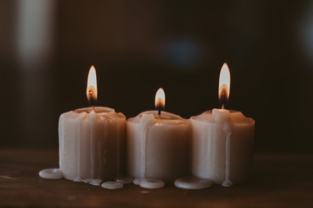 3 lit candles remind us to pray a prayer for the third week of Advent.