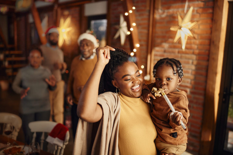 an Black mom and child celebrate the new year with a prayer for new year's resolutions