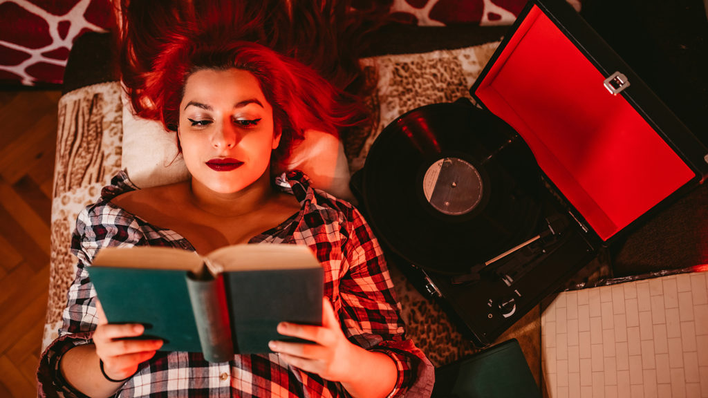 Royalty-free stock photo: A woman turns to praise music and psalms for peaceful rest