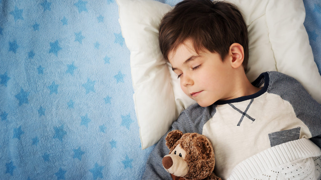 Royalty-free stock photo: Young boy sleeps peacefully