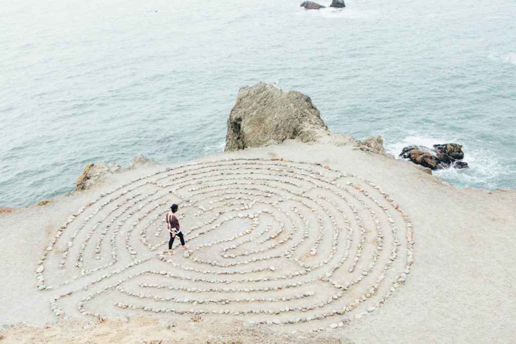 A person walks a prayer labyrinth on the beach and gains confidence to confront challenges to faith.