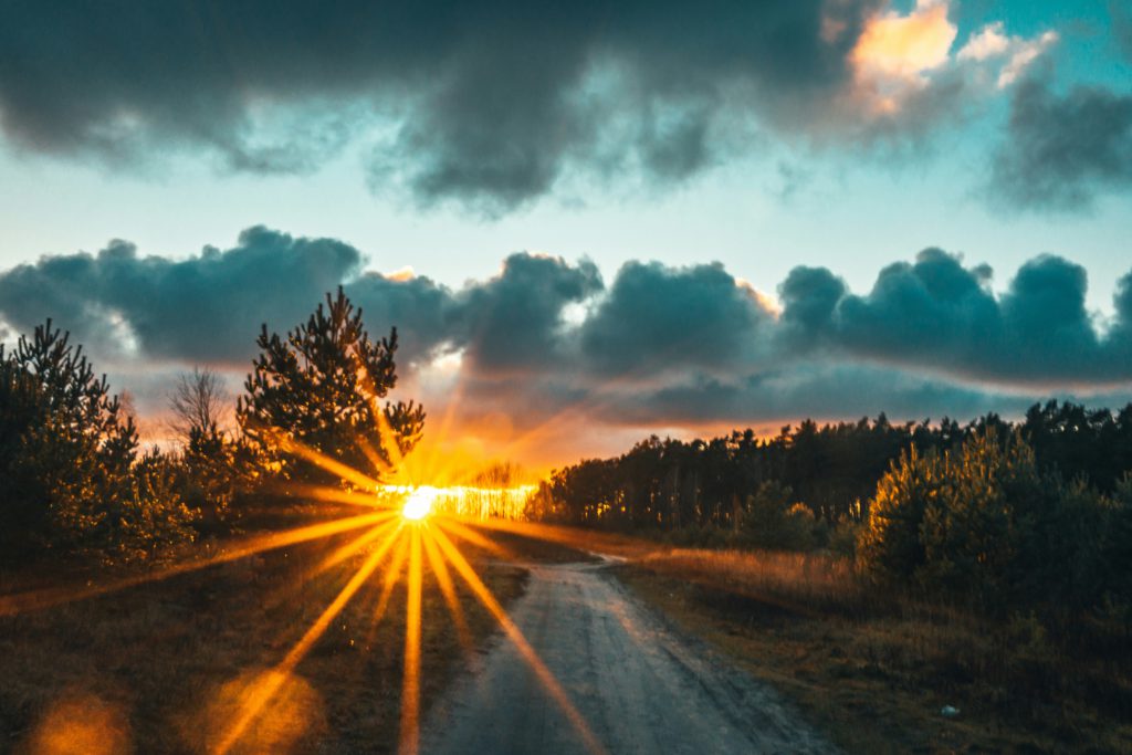 A brilliant sunset through the trees reminds us of the burning bush where God declared "I Am who I Am.'