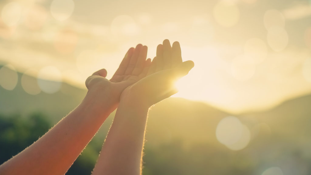 Royalty-Free Stock Photo: Woman's hands placed together while learning to be unoffendable.