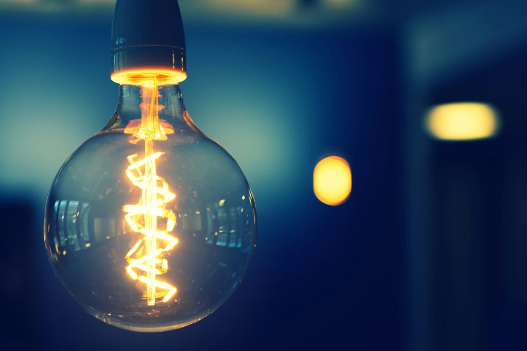 A glowing lightbulb signifies the lightbulb moments God provides through His Word.