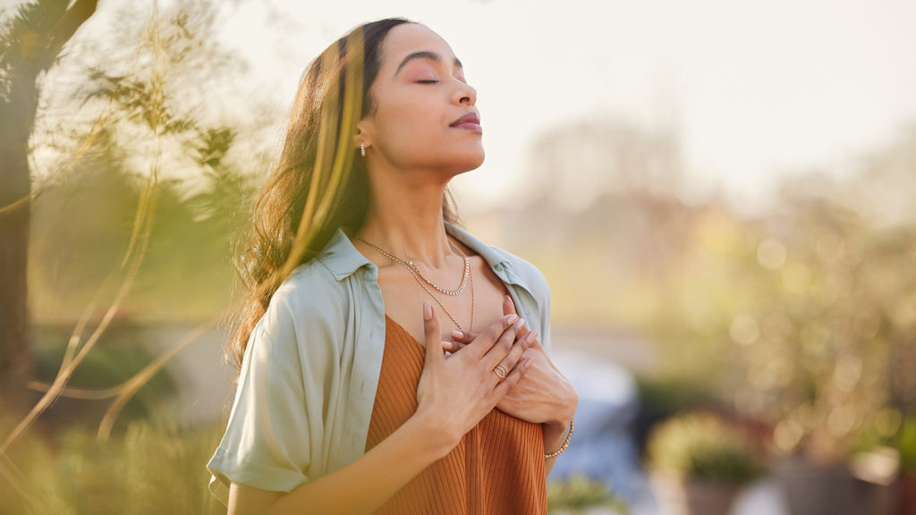 Royalty-Free Stock Photo: Young woman looking up to the sky to uncover God's vision for her.