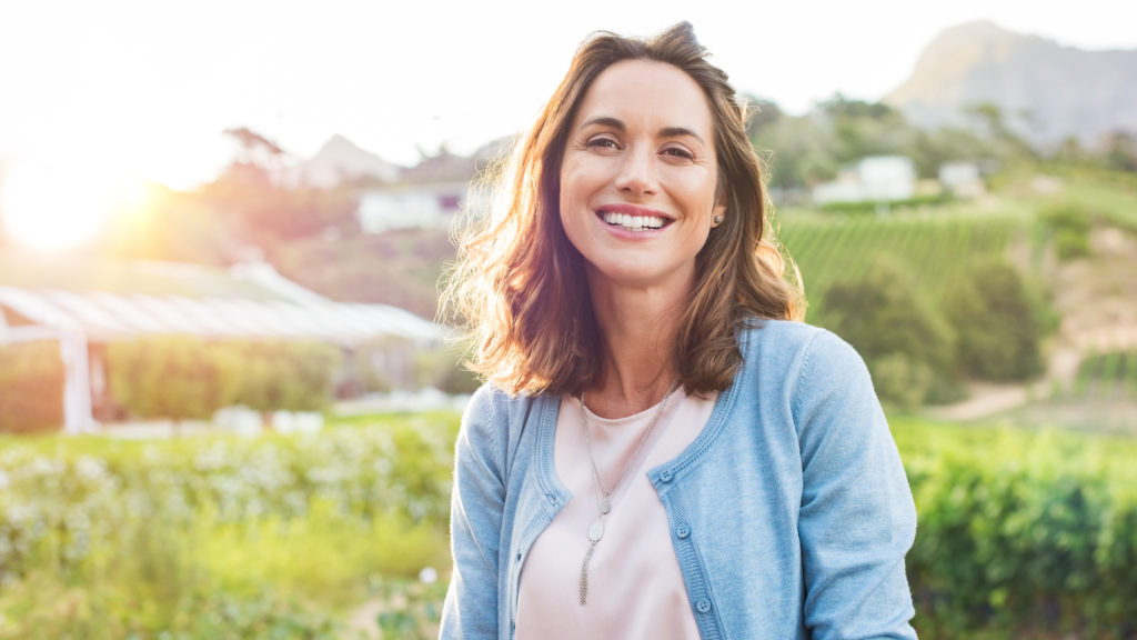 Royalty-free stock image: A contented woman smiles; Getty Images