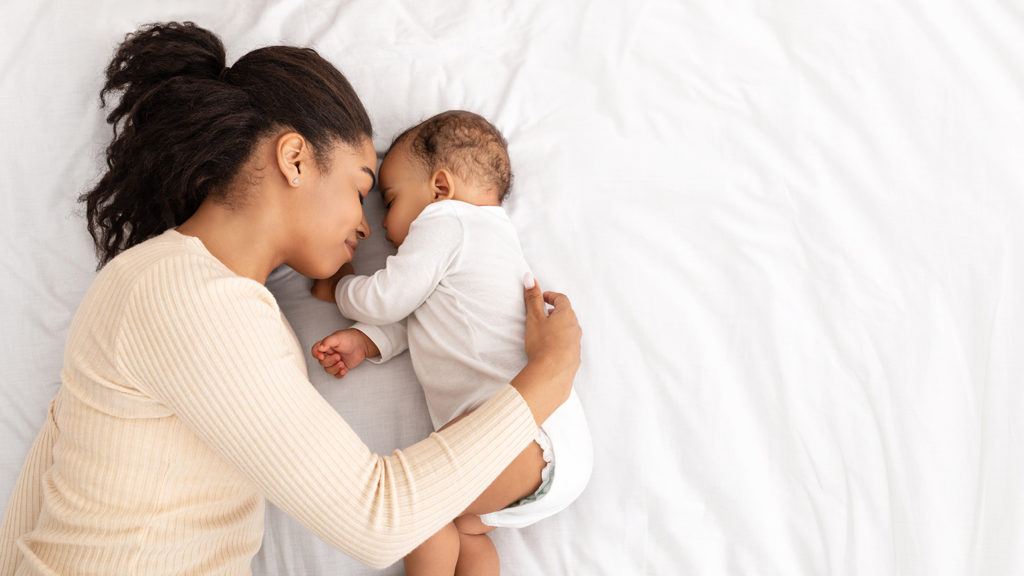 New mom gets some sleep recovery with her newborn baby